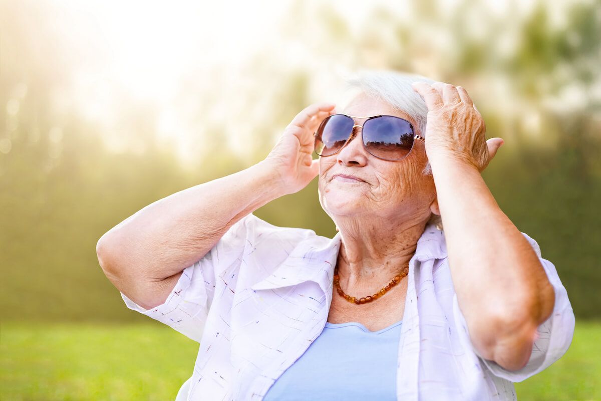 senior woman wearing sunglasses outside_importance of eye health and aging